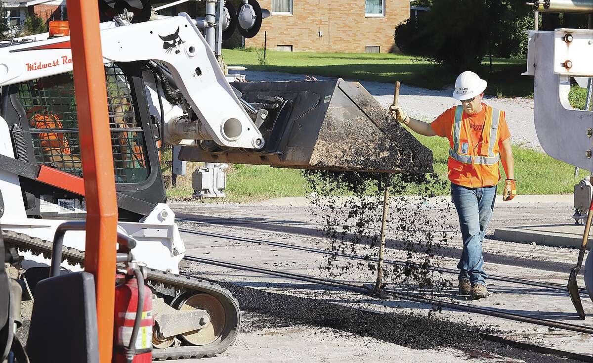 Workers had Washington Avenue by Bowl Haven Lanes closed in both directions to make repairs to the railroad crossing there. Employees of Midwest Railroad were patching near the tracks to make the crossing smoother for cars to cross.