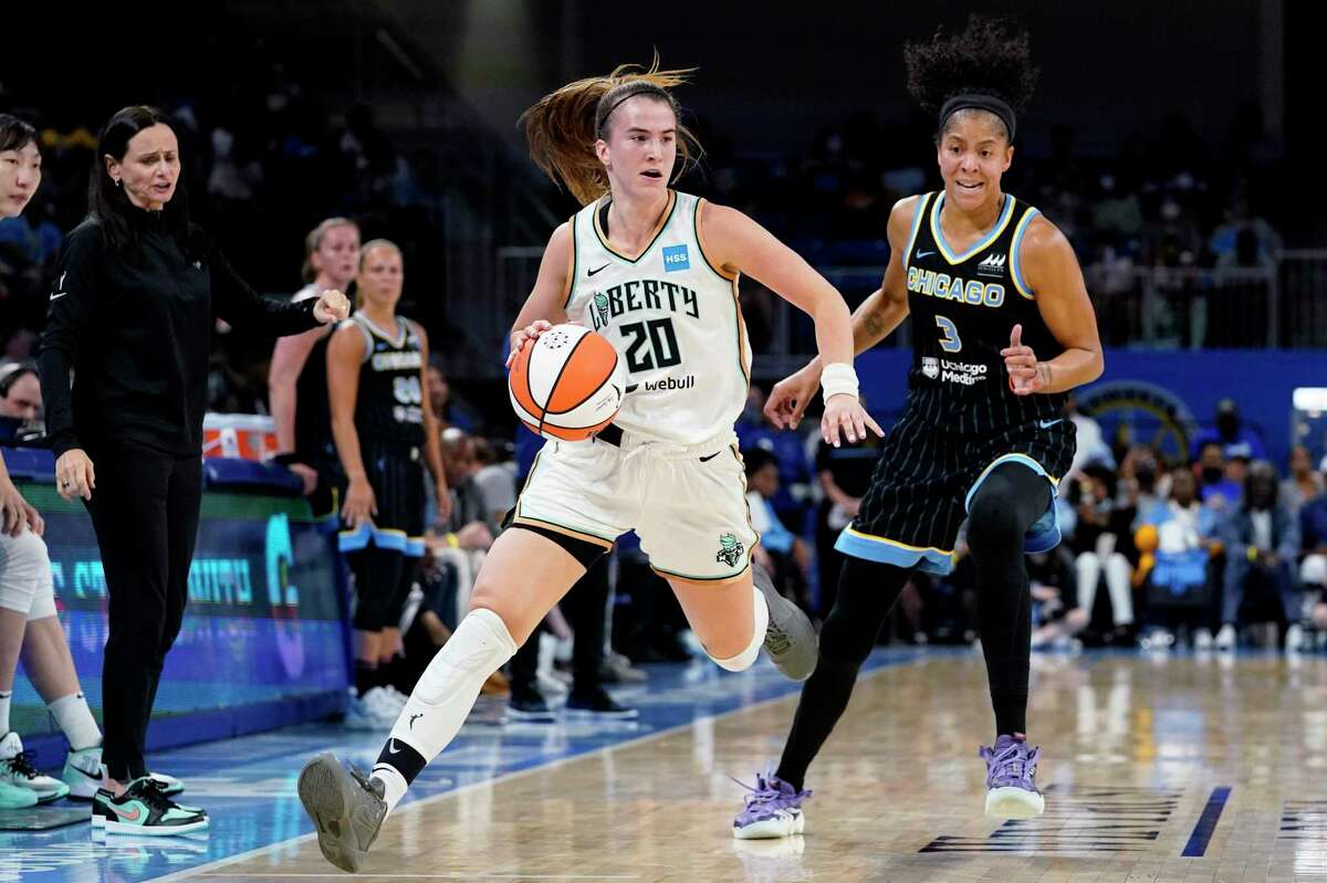 New York Liberty guard Sabrina Ionescu drives past Chicago Sky forward Candace Parker during the first half in Game 1 of their first-round playoff series in Chicago.