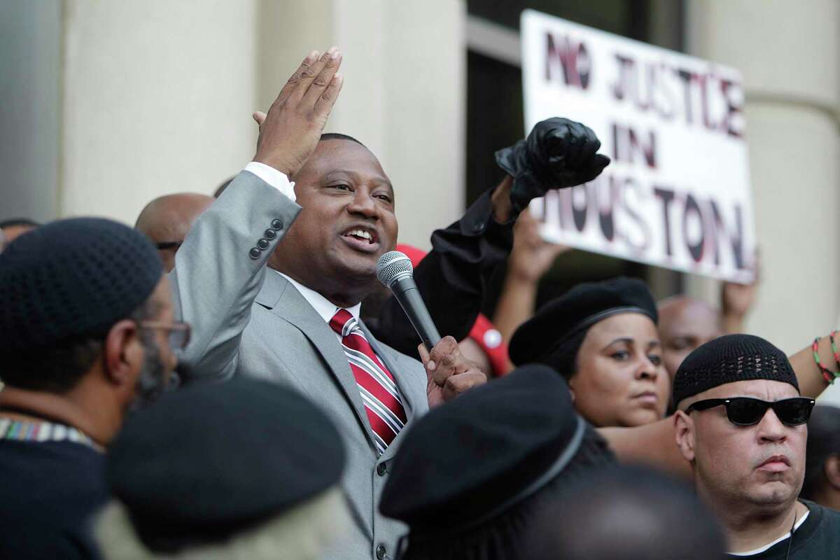 Quanell X delivers a speech during a protest outside the Harris County Criminal Courthouse in response to the not guilty verdict handed down by a jury on May 17, 2012, in Houston. Andrew Blomberg had been accused of official oppression for his role in the beating of Chad Holley in March of 2010, after the then 15-year-old Holley broke into a home and ran from police. ( Mayra Beltran / Houston Chronicle )