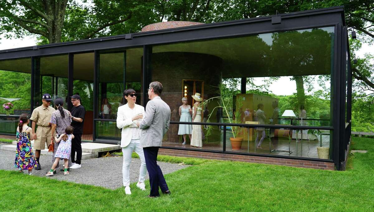 New Canaan and other wealthy towns made it onto the state’s list of “disproportionately impacted areas” for favorable treatment in the marijuana legalization rollout, due to a quirk in the data. Above is a fundraiser at the famous Glass House in New Canaan.