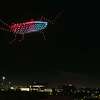 A cockroach zooms over Houston in a Raid-sponsored drone show at Post Houston.