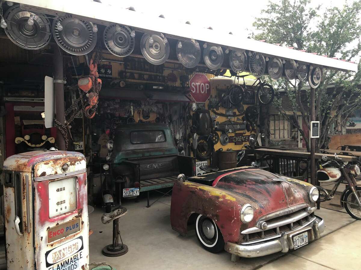 The "FracRat Garage" uses the bed of an old pickup and other car parts as seating for guests at The Destination.