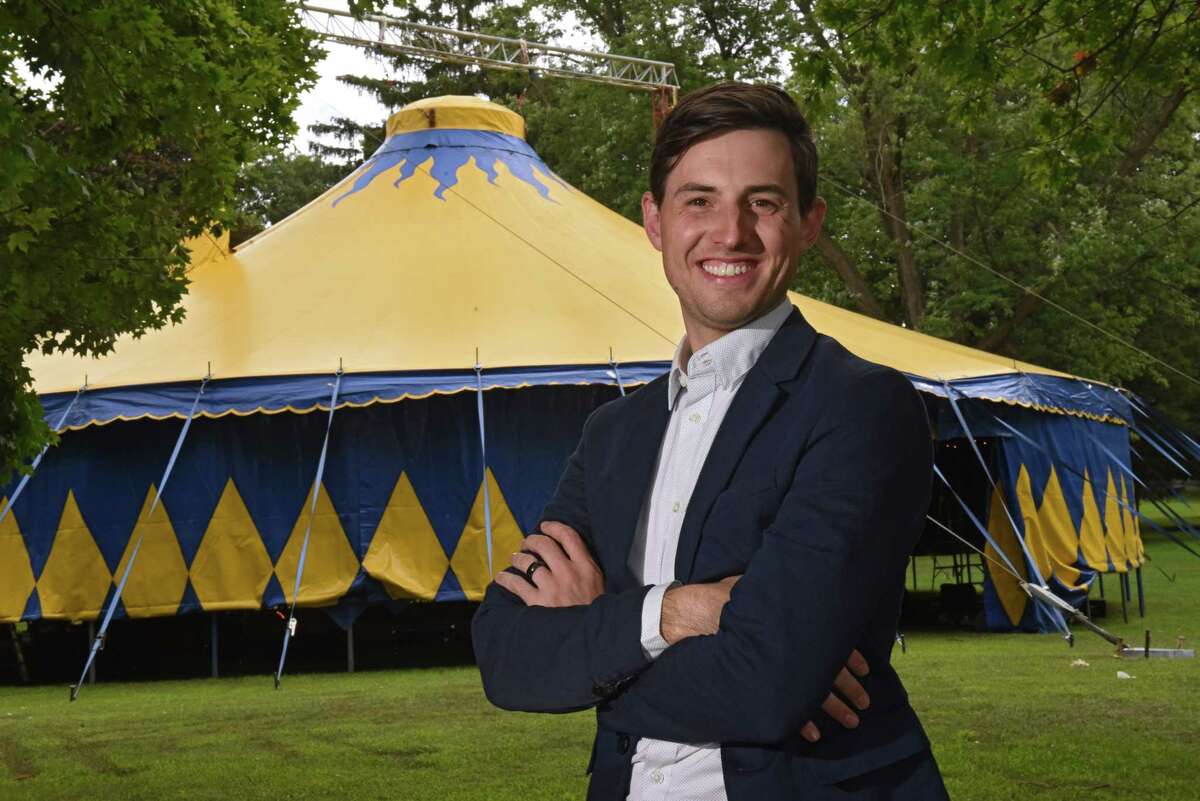 Aaron Marquise, executive director of Troy-based Contemporary Circus and Immersive Arts Center, stands in front of the circus tent at Prospect Park on Thursday, Aug. 18, 2022 in Troy, N.Y.