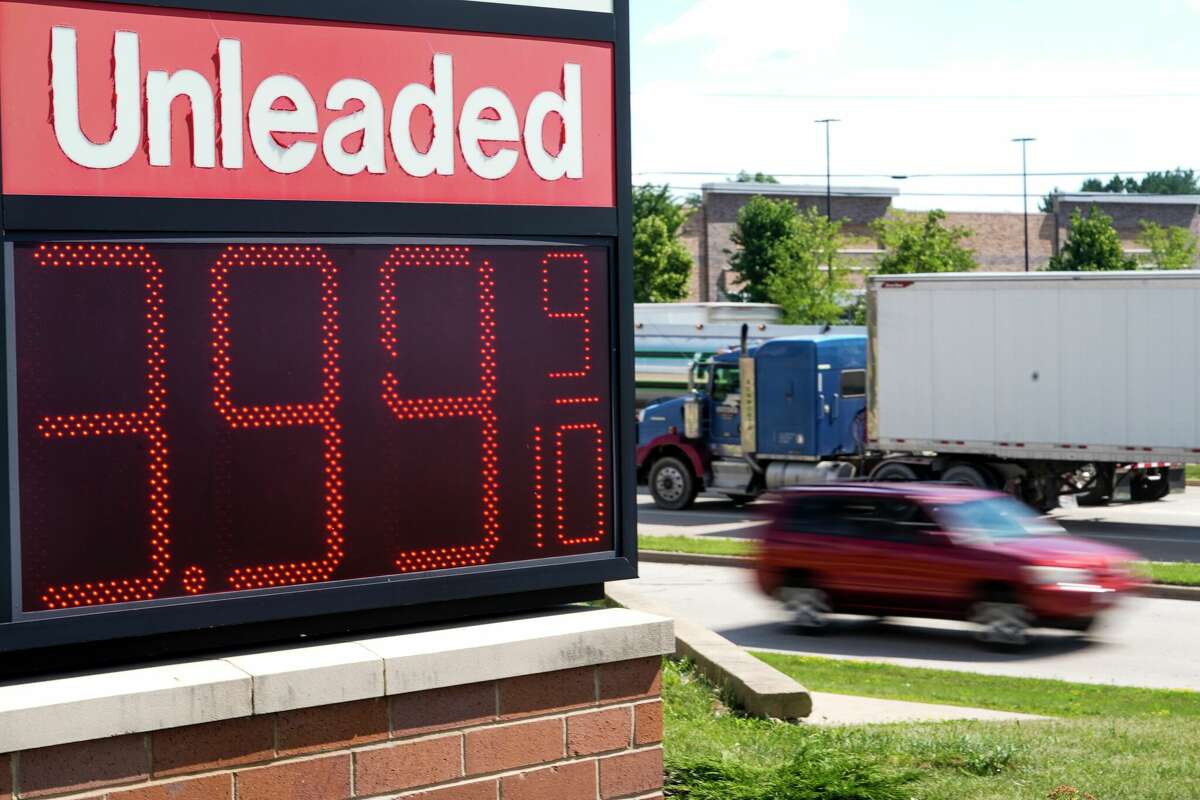 Falling gas prices gave Americans a slight break from the pain of high inflation last month, though the surge in overall prices slowed only modestly from the four-decade high it reached in June.