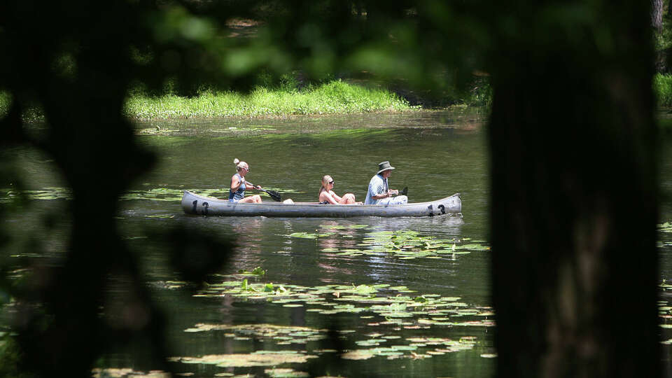 A family canoes together on the lake day at Huntsville State Park on Sunday, June 7, 2009 in Huntsville TX. Texas State Parks are finding it hard to keep up with the amount of new visitors which have prompted initiatives to add more land to the state park system.