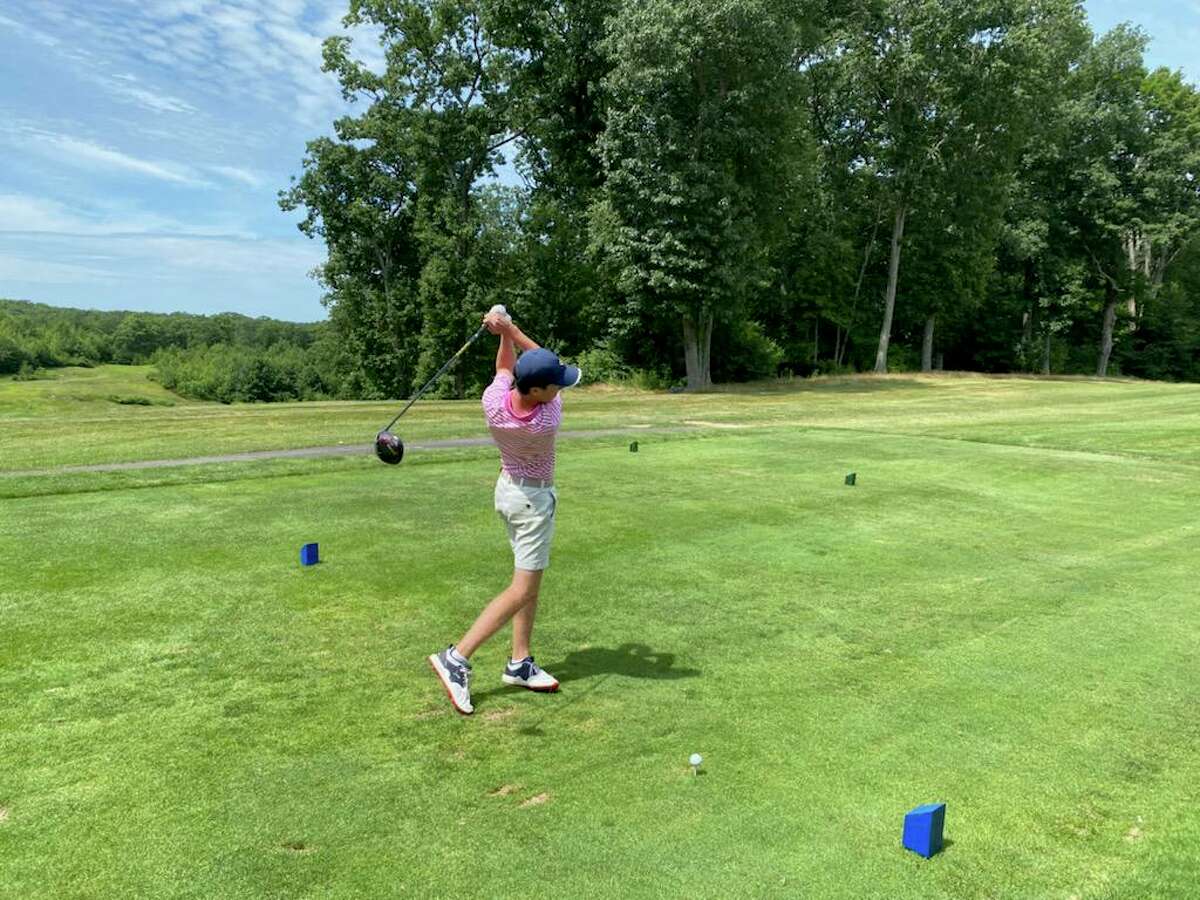 Pomperaug’s Dan Casanta tees off on the first hole at Highfield Country Club in Middlebury.on August 16, 2021. The first fall boys golf season began on Monday.