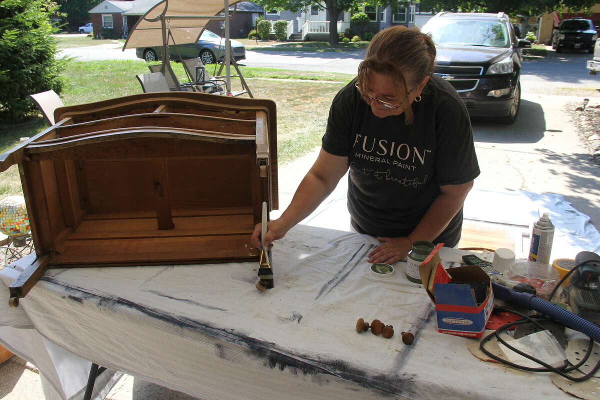 Rose Smith works on a few pieces for her sale Saturday.
