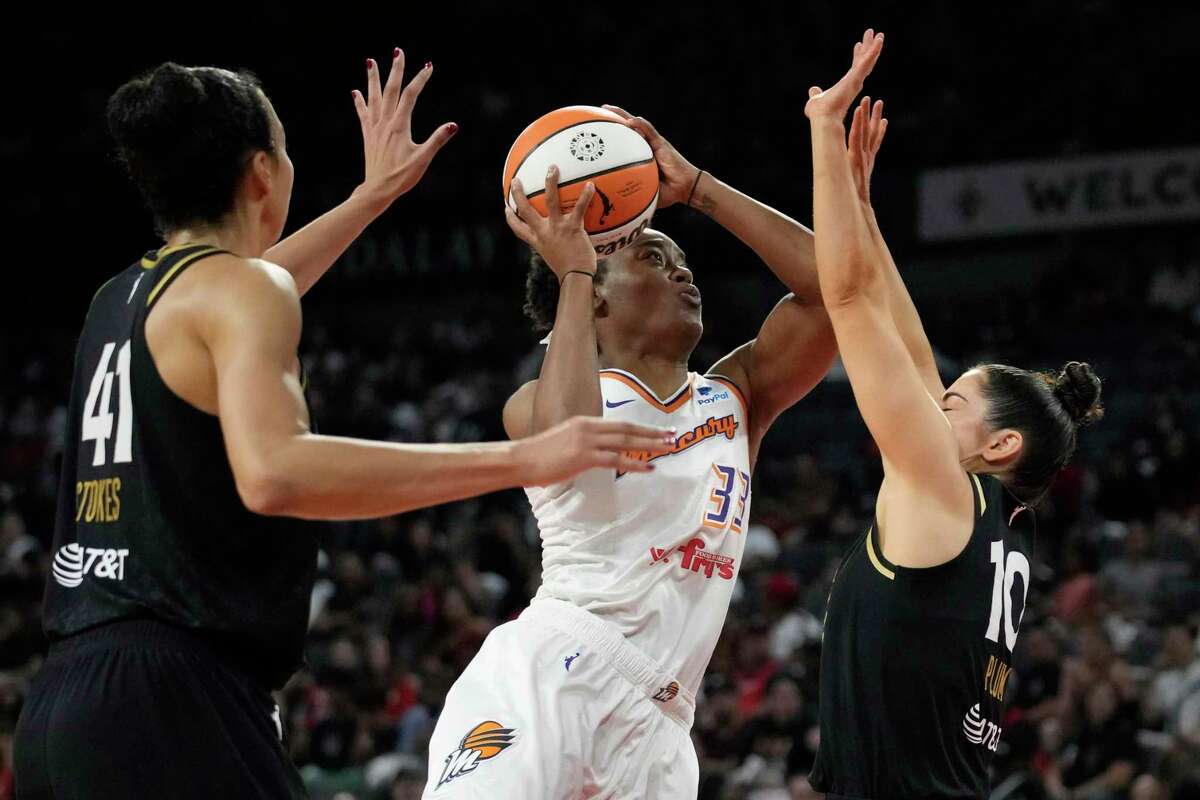 Phoenix Mercury forward Kristine Anigwe shoots over Las Vegas Aces guard Kelsey Plum (10) during the second half in Game One of a WNBA basketball first-round playoff series Wednesday in Las Vegas.
