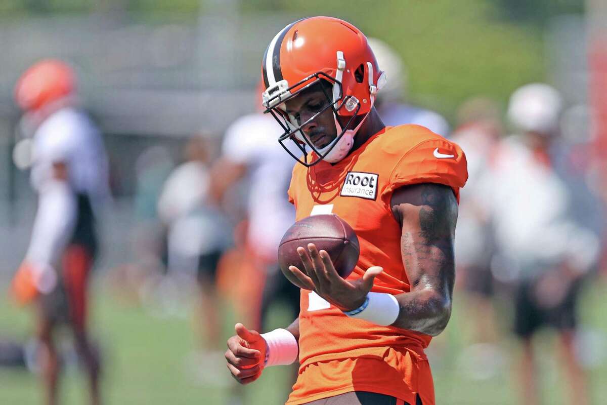 Cleveland Browns quarterback Deshaun Watson works out during a joint practice with the Philadelphia Eagles at NFL football training camp, Thursday, Aug. 18, 2022, in Berea, Ohio,. Watson has reached a settlement with the NFL and will serve an 11-game unpaid suspension and pay a $5 million fine rather than risk missing his first season as quarterback of the Cleveland Browns following accusations of sexual misconduct while he played for the Houston Texans. (Joshua Gunter/Cleveland.com via AP)