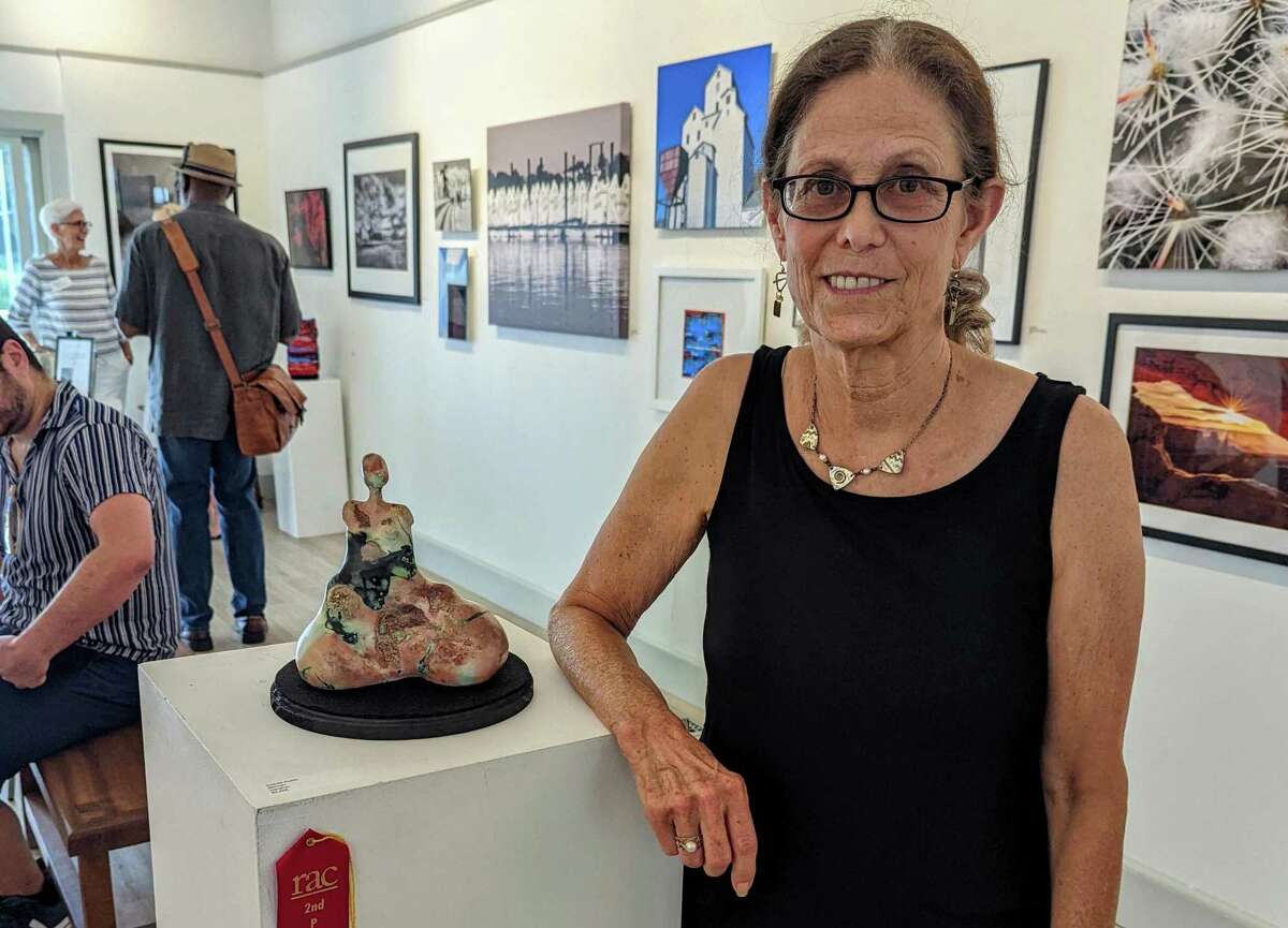 A Westport resident has been honored, and has won second place in the Rowayton Arts Center’s, RAC’s, art show, and exhibition that is titled: “Photography and Sculpture,” and that honors local artists. Andrea Rubin, who is shown, also earned the recognition for her sculpture that is titled: “Woman.”