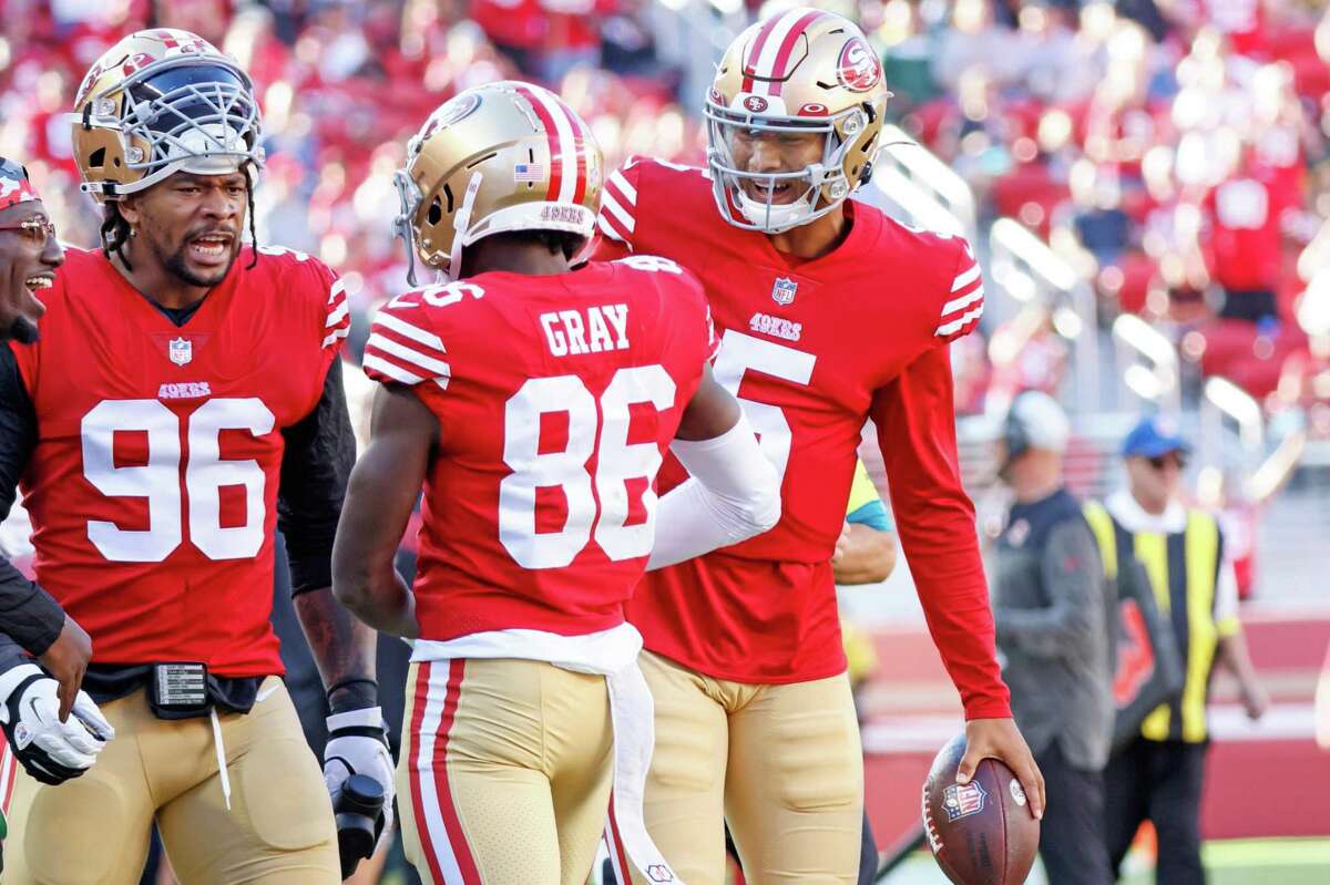 San Francisco quarterback Trey Lance (5) celebrates his touchdown throw to 49ers wide receiver Danny Gray (86) in the first quarter of the team’s first preseasn game against the Packers last week.