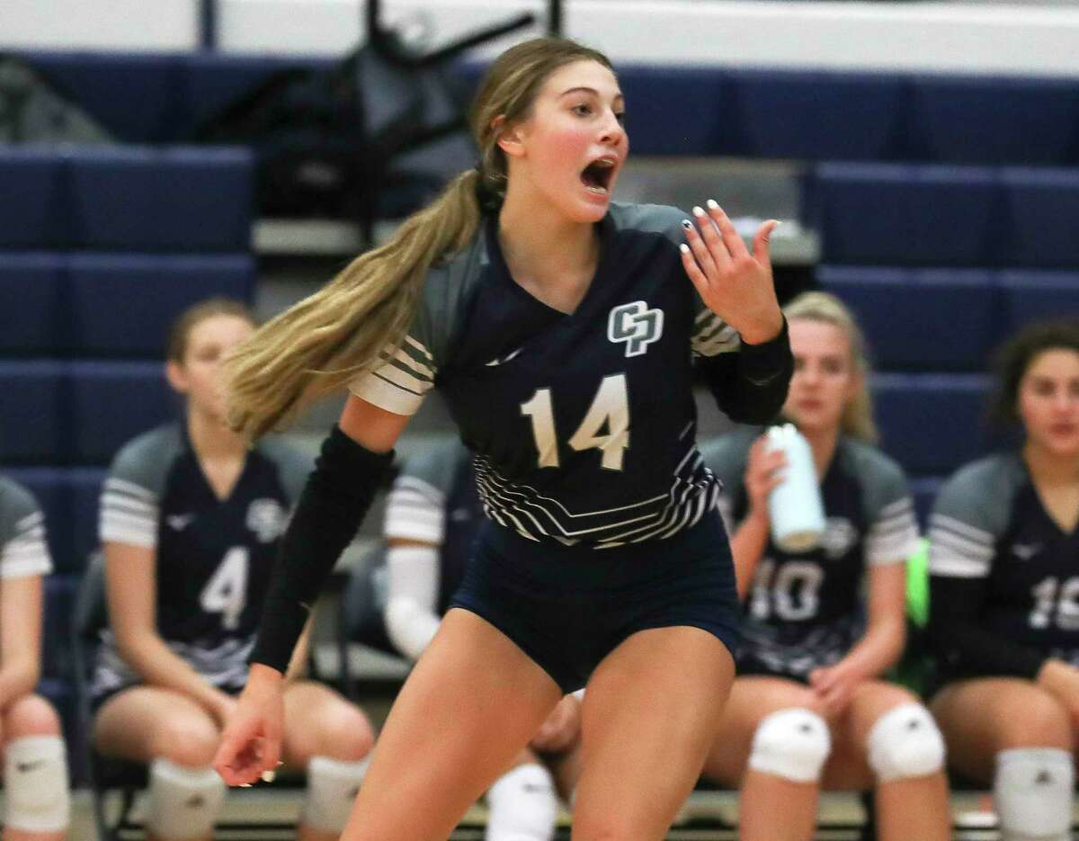 College Park's Caroline Prihoda (14) calls a serve out of bounds in the first set of a non-district high school volleyball match at Kingwood High School, Thursday, Aug. 18, 2022, in Kingwood.