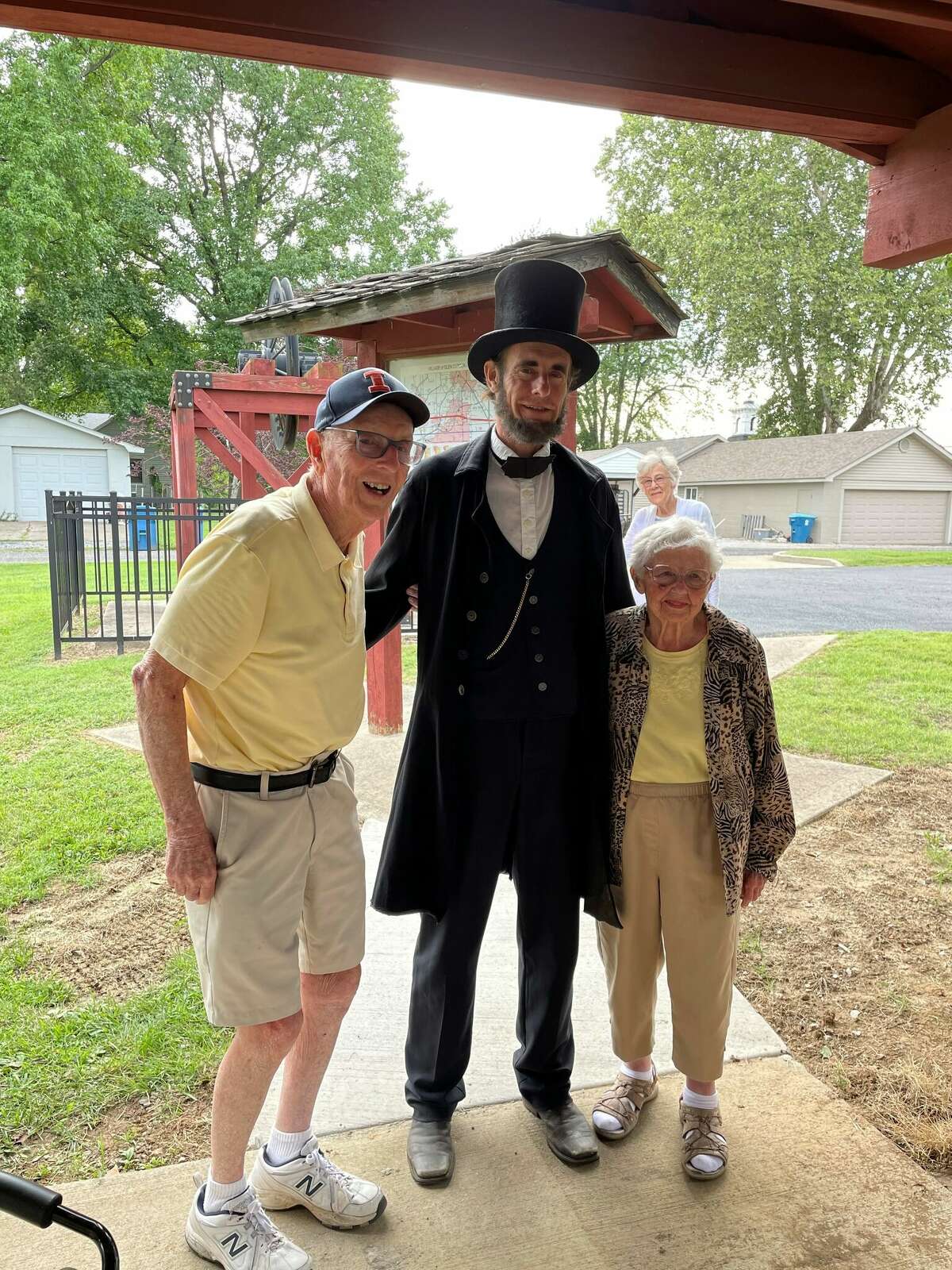 Former Glen Carbon Mayor Ron Foster, left, with his wife, Joan Foster, and an Abraham Lincoln re-enactor.