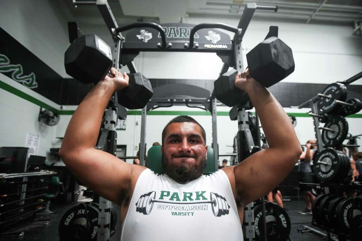 Kingwood Park offensive lineman Erick Zapata lifts during a workout in the weight room after school Wednesday, Aug. 17, 2022 in Kingwood.