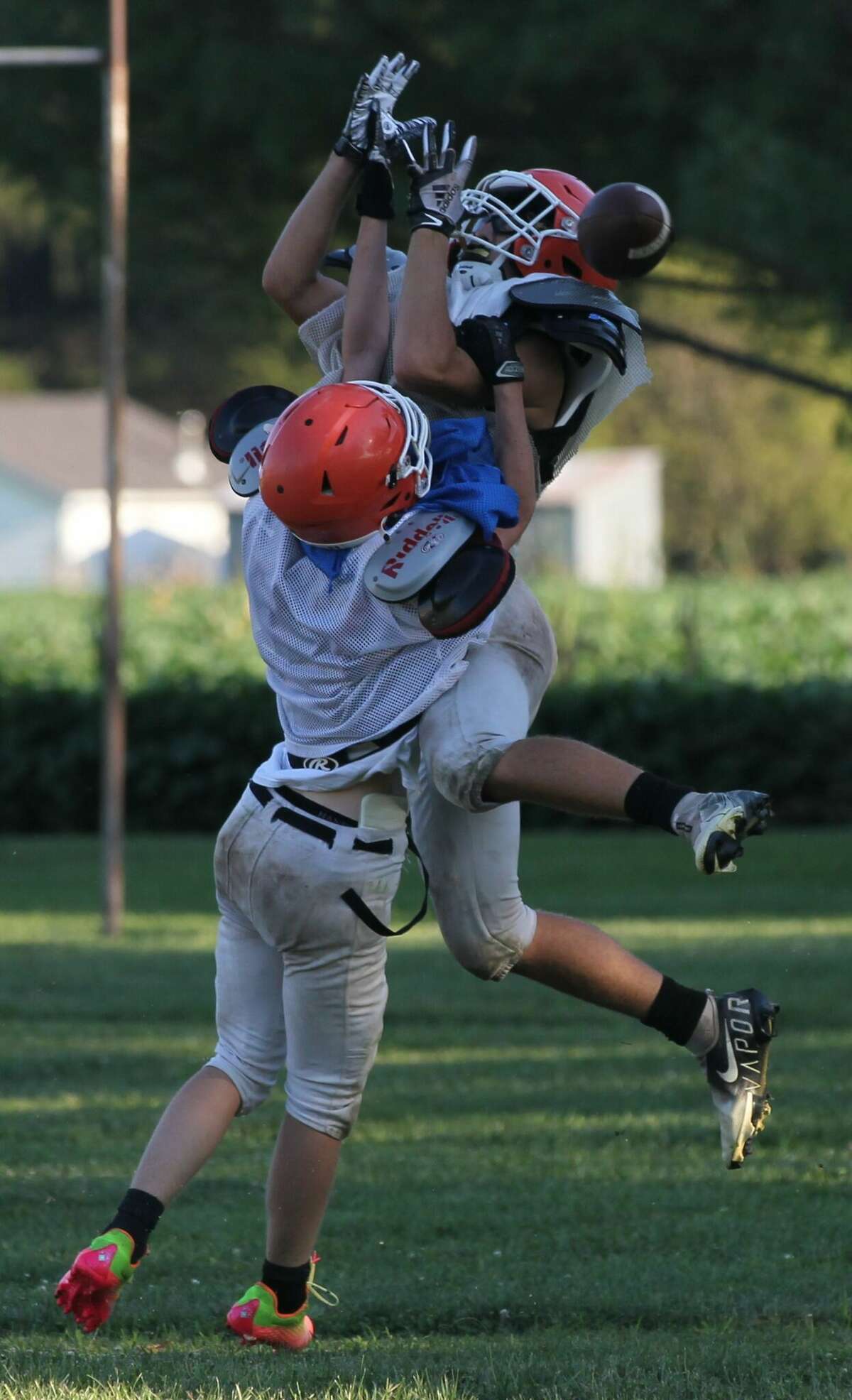 A Greenfield-Northwestern defender bats the ball away on a pass play during football practice earlier this week.