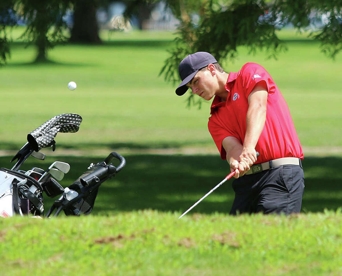 Alton sophomore Sam Ottwell chips onto the green on the fourth hole at Belk Park in Thursday's Madison County Tournament in Wood River. Ottwell, playing No. 1 for the Redbirds, shot 78.