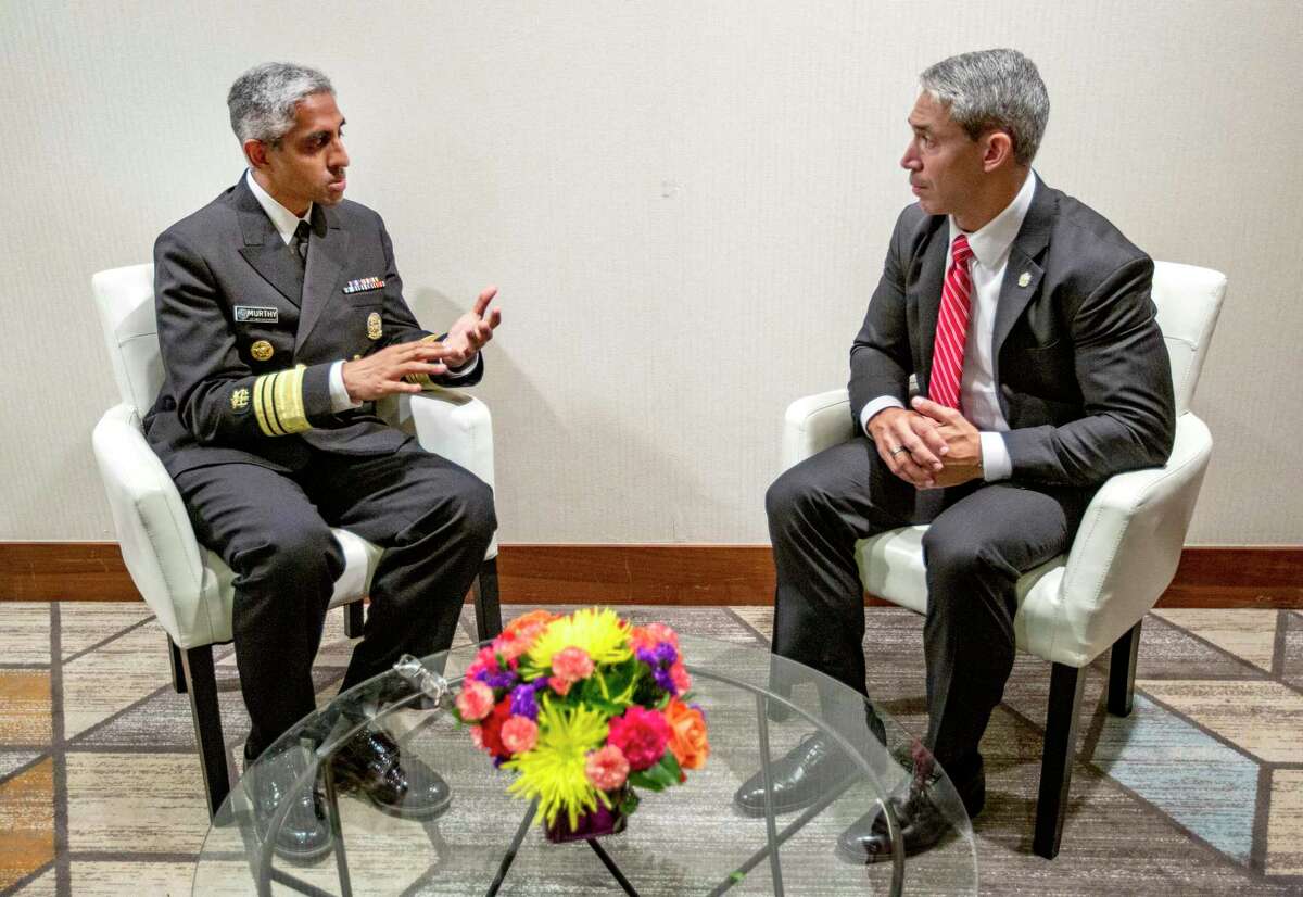 Surgeon General Dr. Vivek H. Murthy, left, talks with San Antonio Mayor Ron Nirenberg in July during the UnidosUS annual conference in San Antonio.
