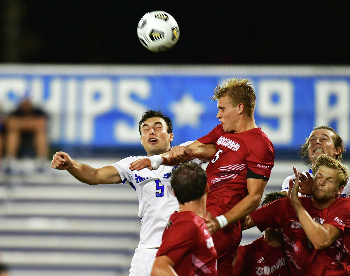 SIUE's Max Broughton (5 in red) heads the ball during last season's 1-1 Bronze Boot Game tie with Saint Louis University. Broughton,a team a co-captain, is one of the players SIUE coach Cale Wassermann is counting on to help push the Cougars over the hump this season. Of the 10 SIUE losses suffered last fall, seven were by one goal.