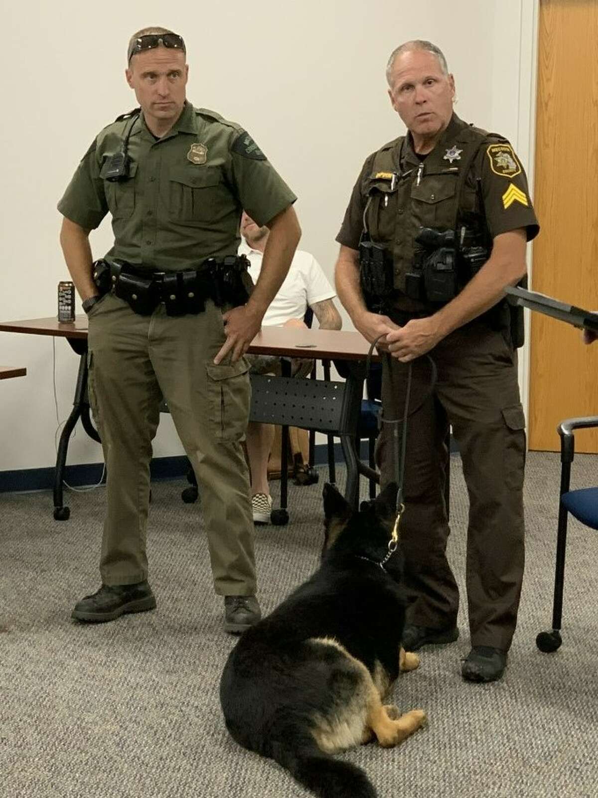 Mecosta County Deputy Sgt. Charley Pippin and K9 Deputy Zeke, along with conservation office Josh Reed, were presented with outstanding service awards by Sheriff Brian Miller recently. Detective Mike Mohr was presented the award in absentia.