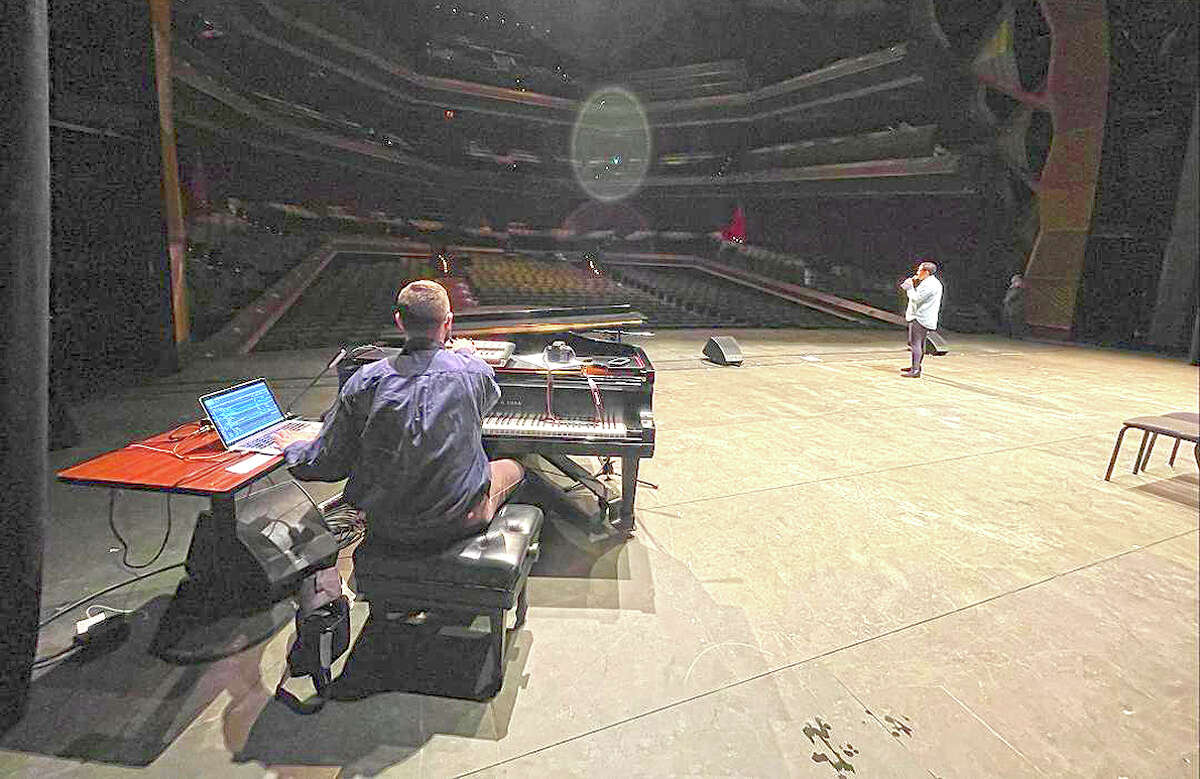 John Love sits at the keyboard as he and Jillian Ebanks work on the Second City stage.
