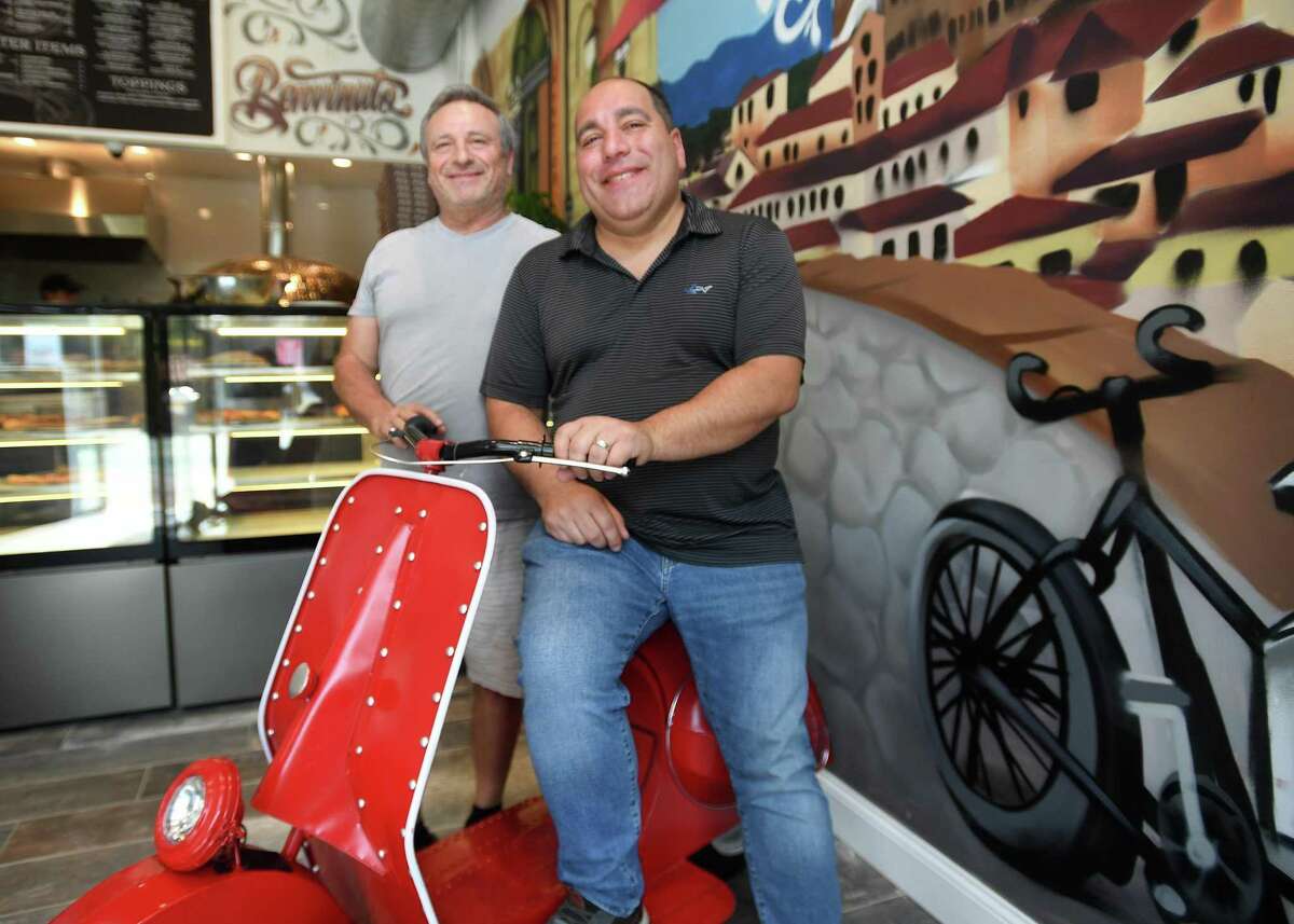 Joseph Tola, right, from Queens, NY, and his uncle, Filippo Fedalino, at Una Dolce Vita, just opened at 940 Broad Street in Bridgeport, Conn. on Thursday, Aug. 18, 2022.