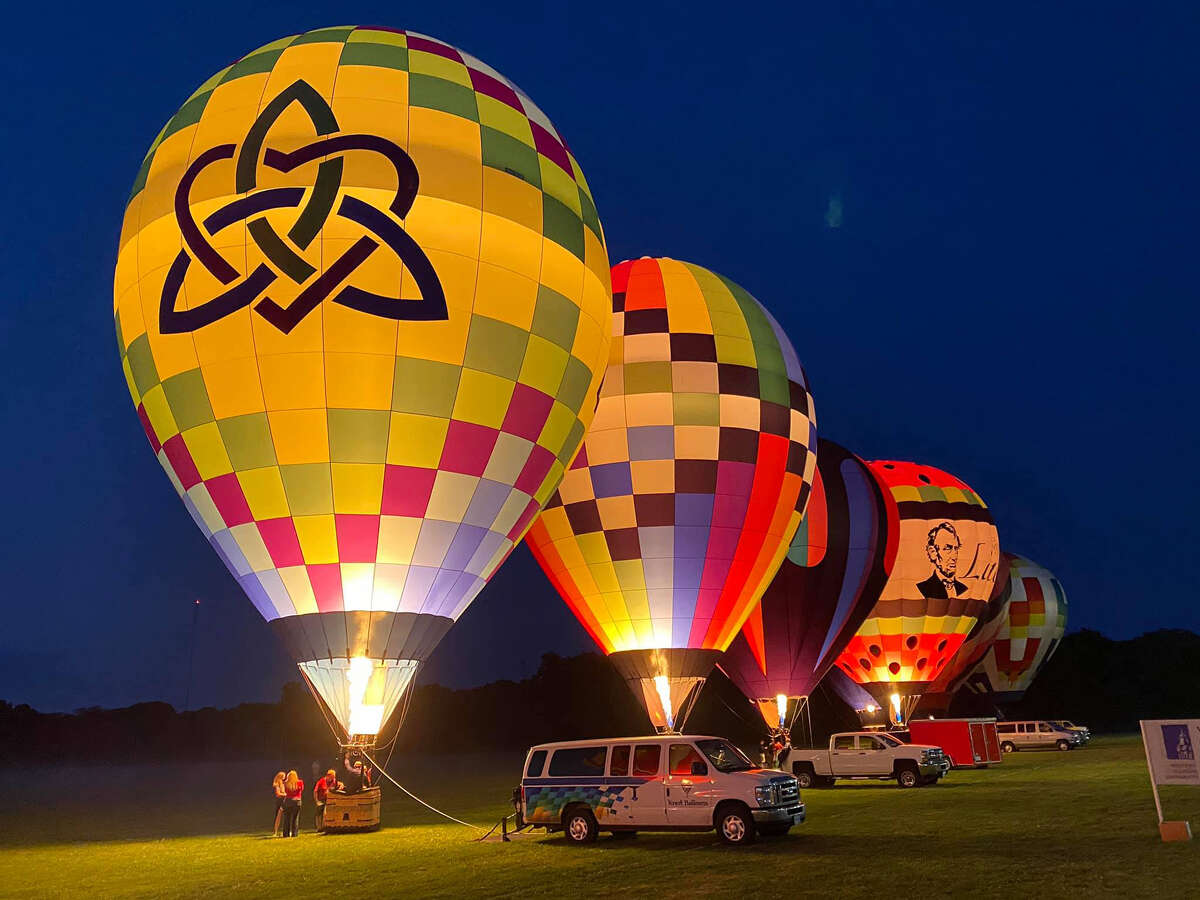 Balloons light up the night sky in September 2020 in Macomb during the Macomb Balloon Rally. This year's event will be Sept. 9-10