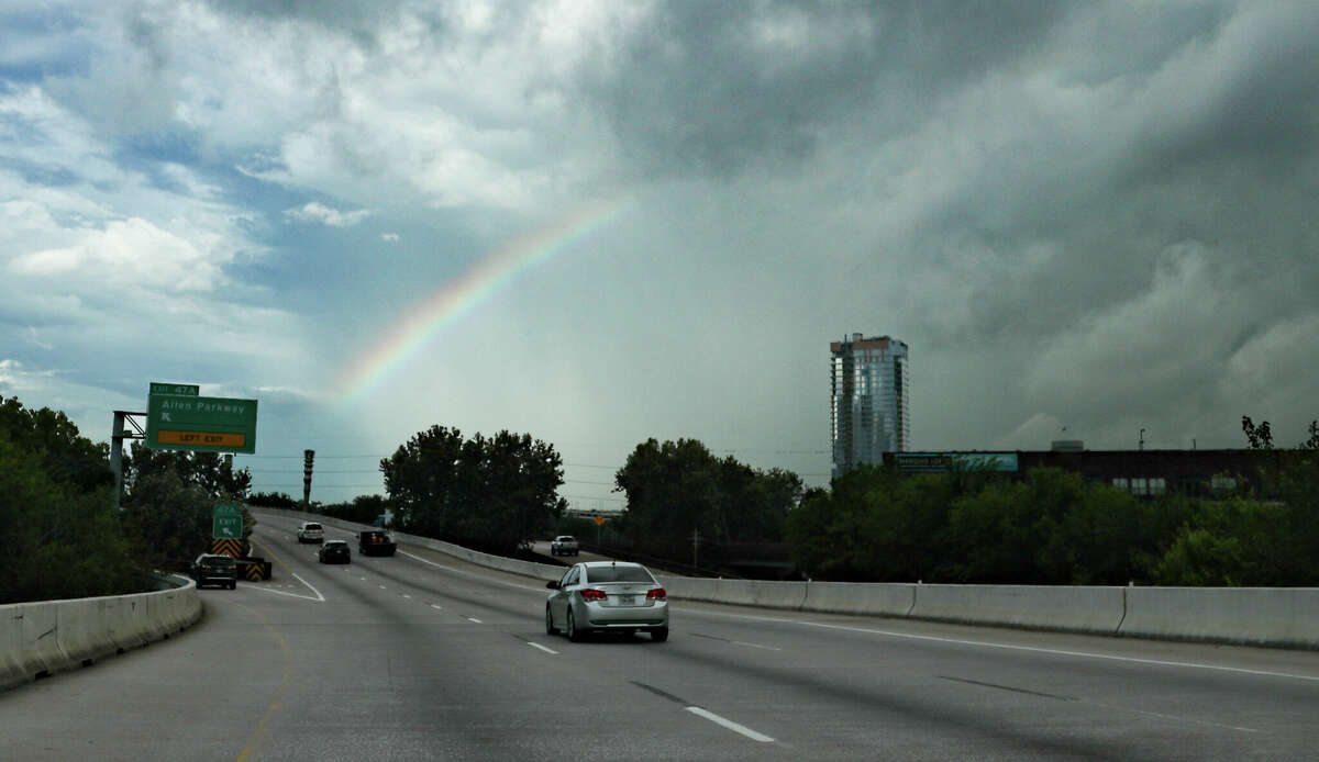 A rainbow appears above I-45 near downtown Houston following rain on Friday, Aug. 19, 2022.