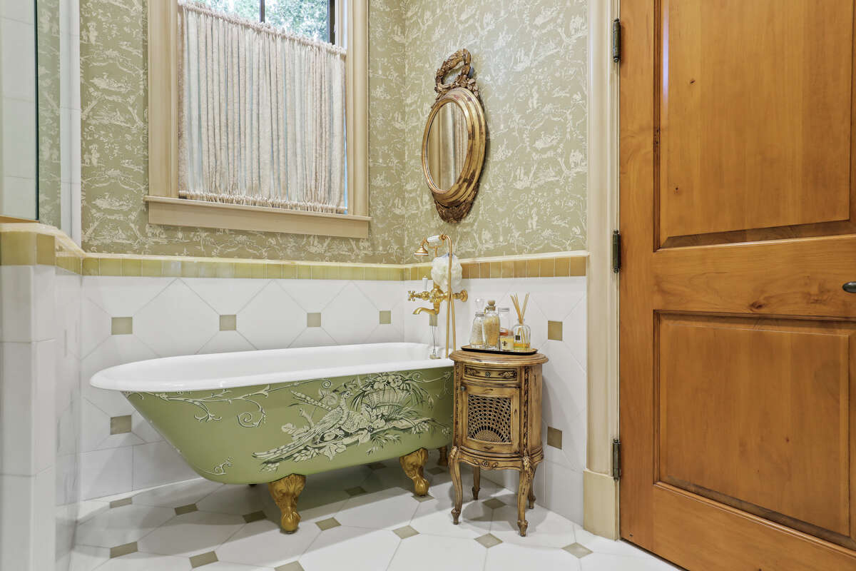 A clawfoot tub in one of the 8 full bathrooms.