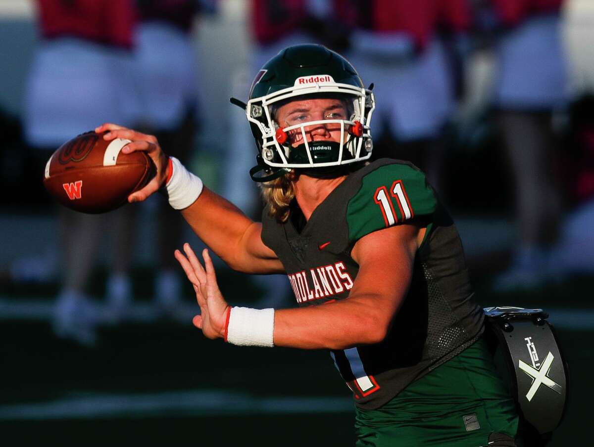 The Woodlands quarterback Mabrey Mettauer (11) warms up before a District 13-6A high school football game at Woodforest Bank Stadium, Thursday, Oct. 7, 2021, in Shenandoah.
