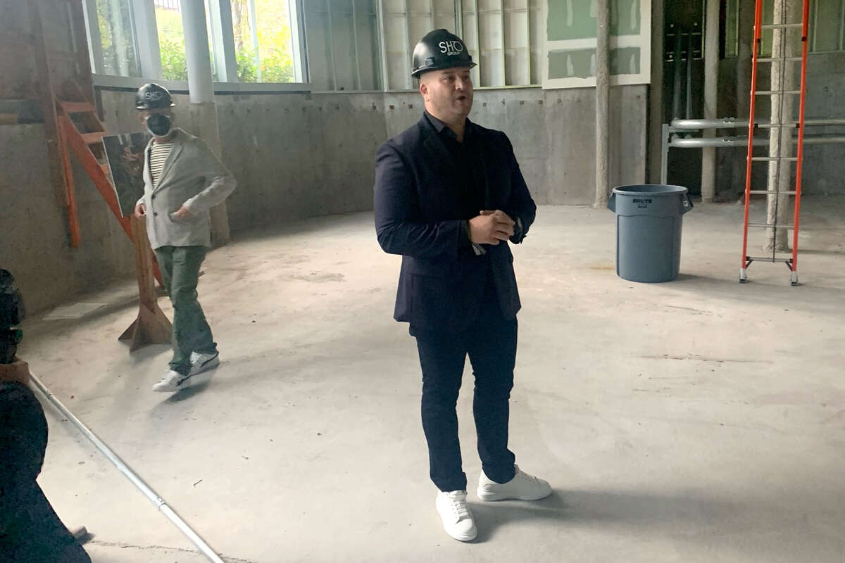 Sho Group CEO Joshua Sigel speaks to the media inside the building that will one day be Sho Restaurant, under one "groundbreaking" event at Salesforce Park in August 2022.