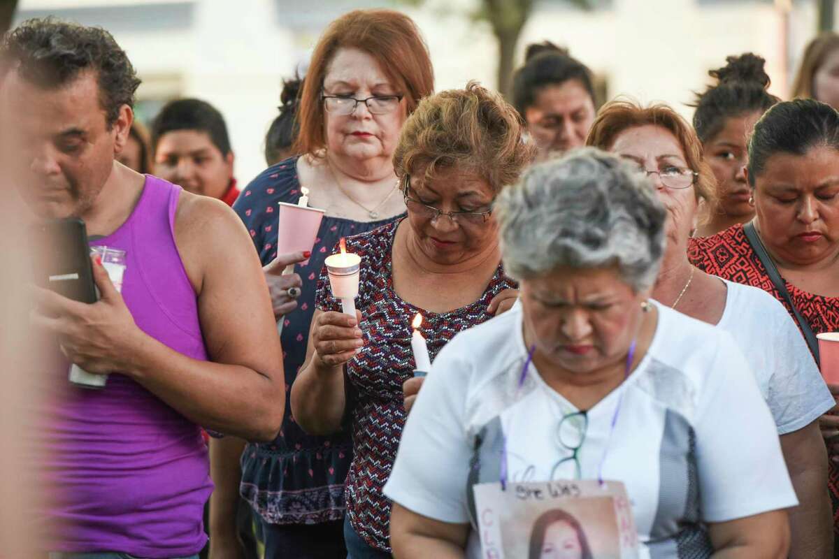 Family and friends of the four alleged victims of Juan David Ortiz gather at San Agustin plaza for a candlelight vigil on Sept. 18, 2018.