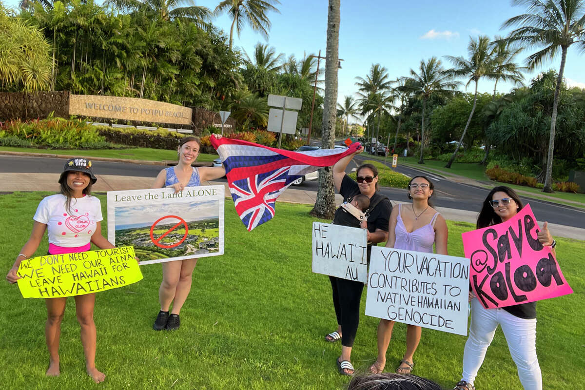 Participants of a Save Koloa march took to the streets to show their opposition to the Kauanoe o Koloa project.
