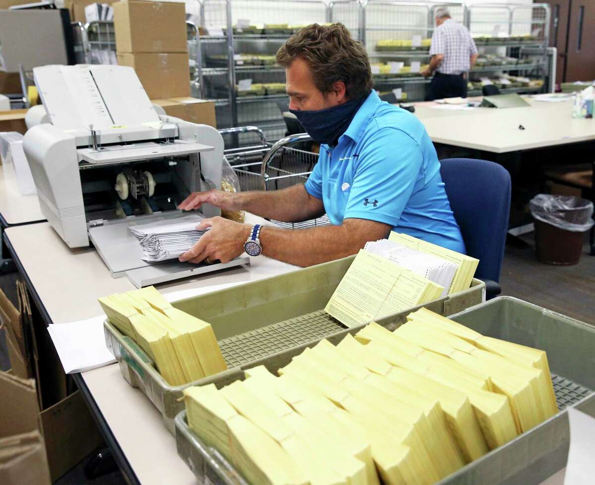 Uli Sommerfeld processes applications as Bexar County Elections Department.