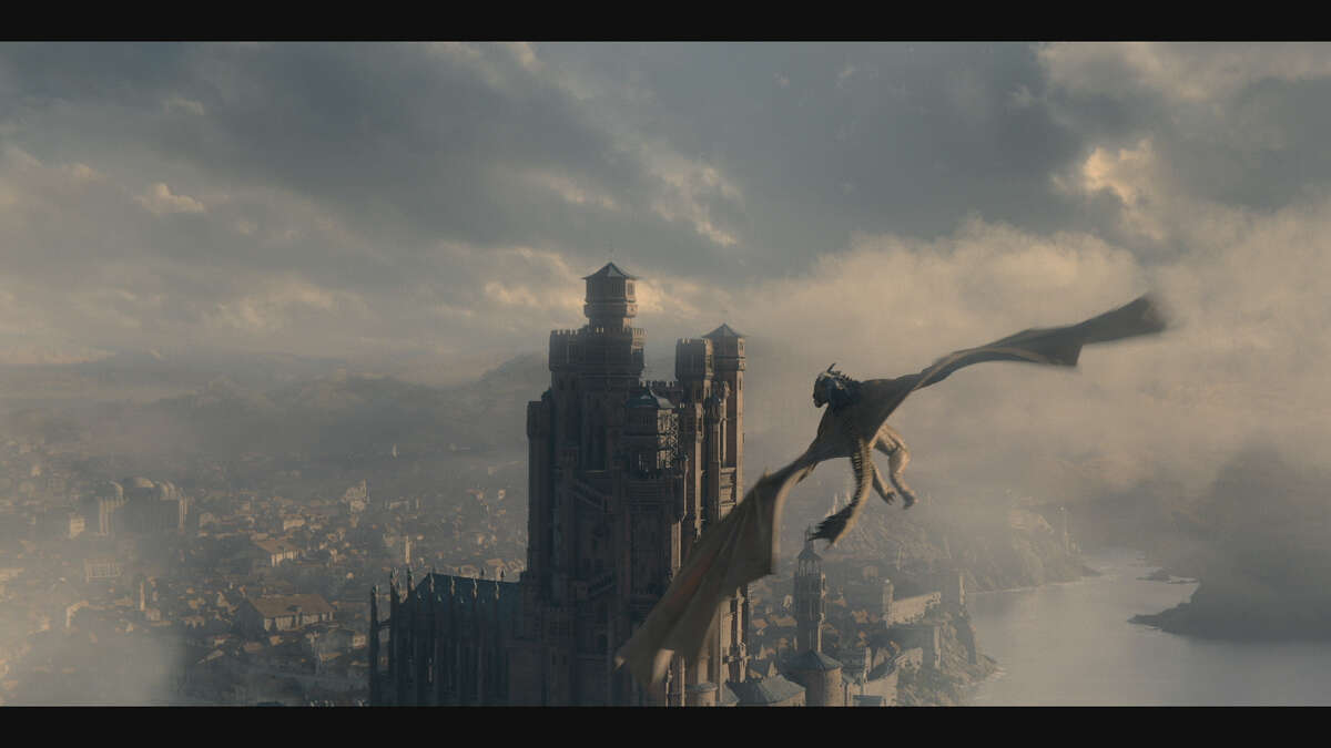 A dragon flying over King's Landing in "House of the Dragon."