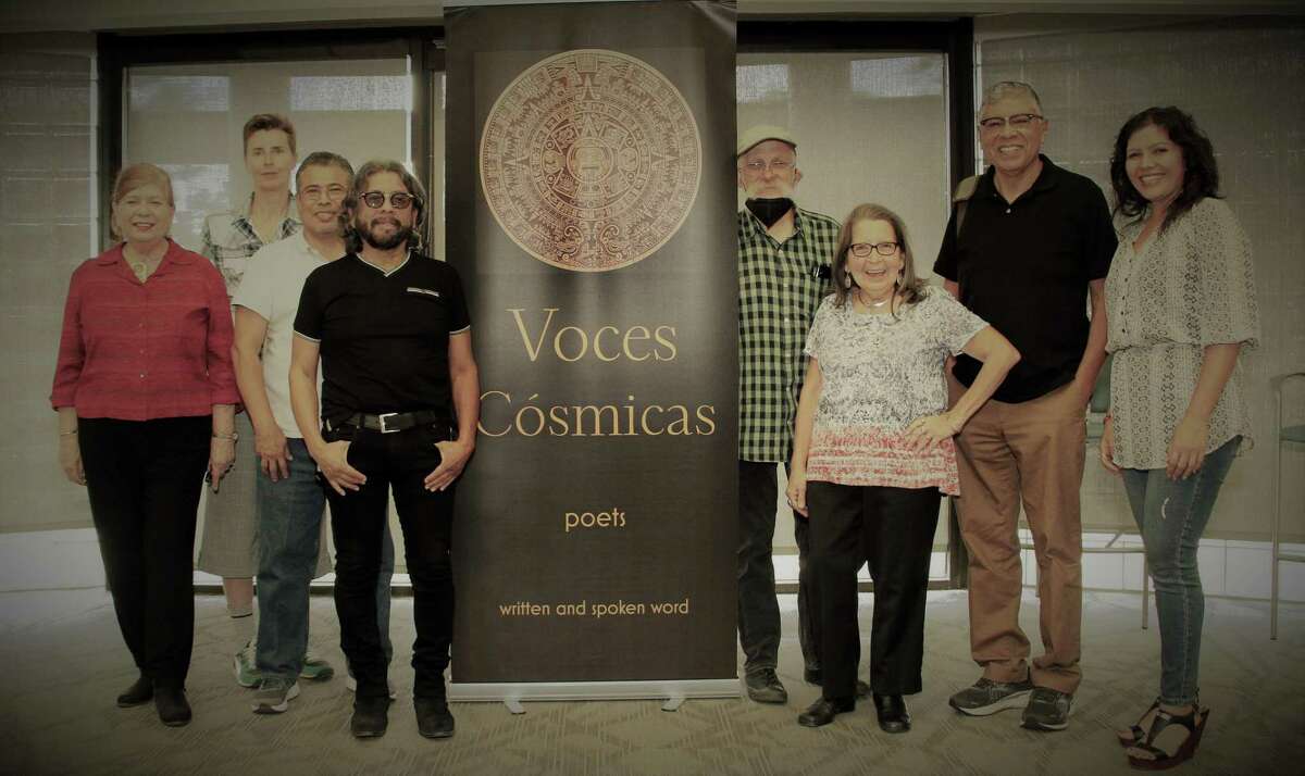 Voces Cósmicas founder Fernando E. Flores, fourth from left, and group members hold regular meetings and volunteer.