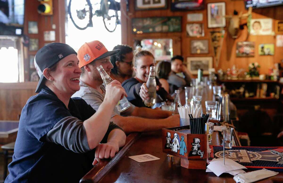 Christina Hunt, far left, cheers with friends at The Connecticut Yankee, a Boston sports bar in San Francisco, Calif. on Friday, Aug. 19, 2022. Hunt, 44, is originally from Lexington, Massachusetts and moved to San Francisco for work in 2011. She said she chose to live in this neighborhood because of this bar, which she comes to after work everyday. She is a big fan of all the Boston sports teams including the Patriots, Celtics, Red Sox, and Bruins. Data found that most Millennials who moved to San Francisco are from Boston.
