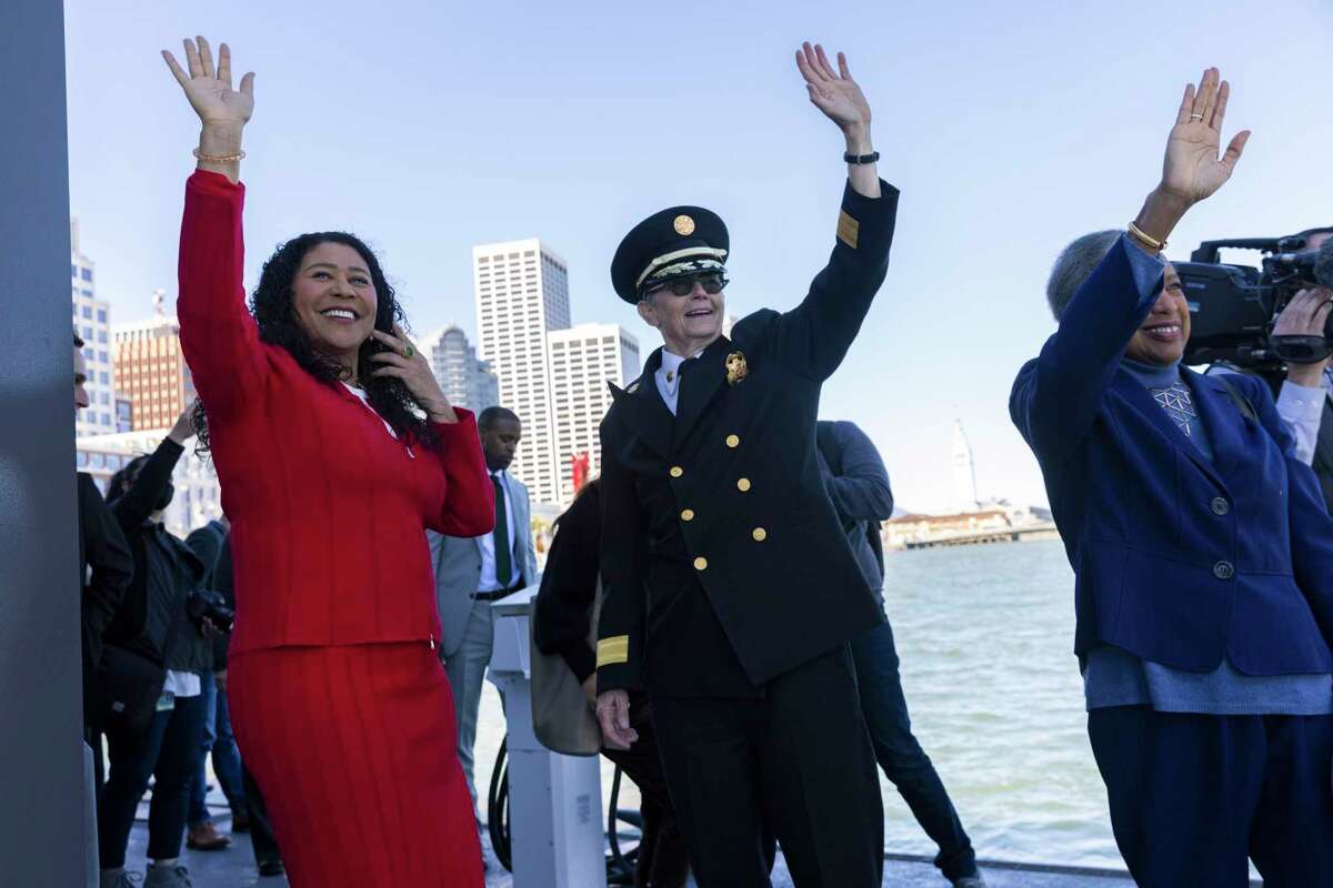 From left: Mayor London Breed with fire chief Jeanine Nicholson and fire commissioner Francee Covington wave at fireboats docking at Fireboat Station 35, Thursday, March 10, 2022, in San Francisco, Calif. The Fire Department accounted for nearly half of the city’s 200 employees who had six figure overtime pay in the 2021 fiscal year.