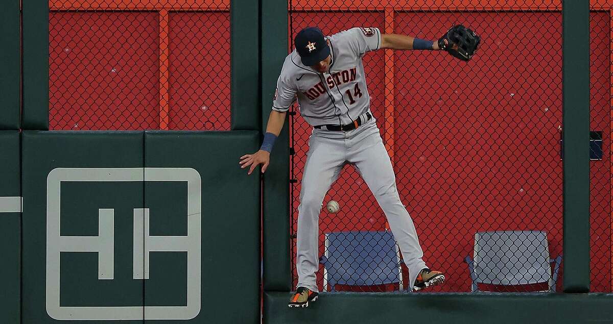 Mauricio Dubon of the World Team slides safely into third base during  News Photo - Getty Images