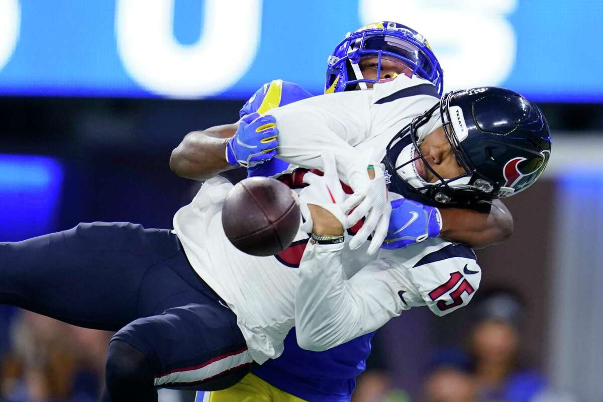 Los Angeles Rams cornerback Tyler Hall, top, breaks up a pass in the end zone intended for Houston Texans wide receiver Chris Moore (15) during the second half of a preseason NFL football game Friday, Aug. 19, 2022, in Inglewood, Calif.