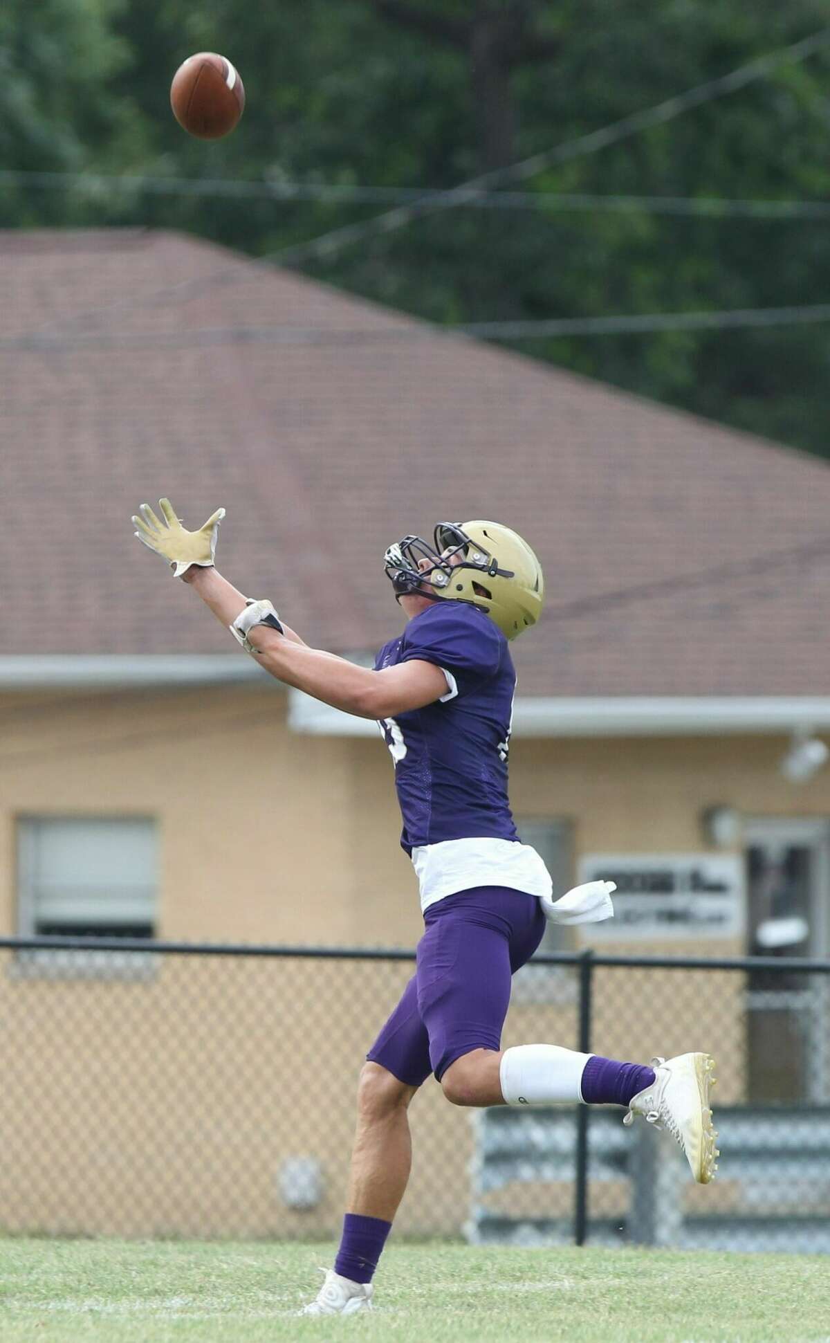 Routt's Ryan Oswald catches a pass with one hand during the Routt football team's scrimmage Friday night.