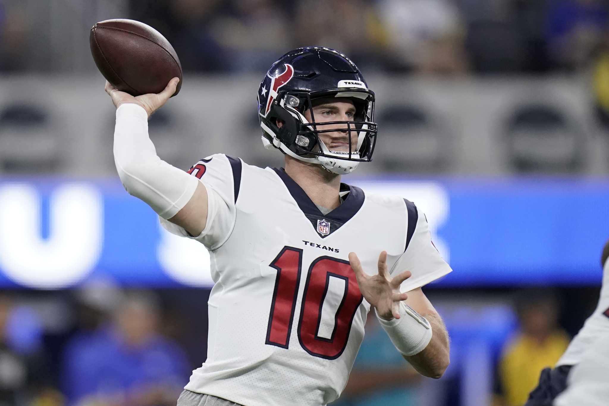 Houston Texans quarterback Davis Mills (10) and NFL referee John