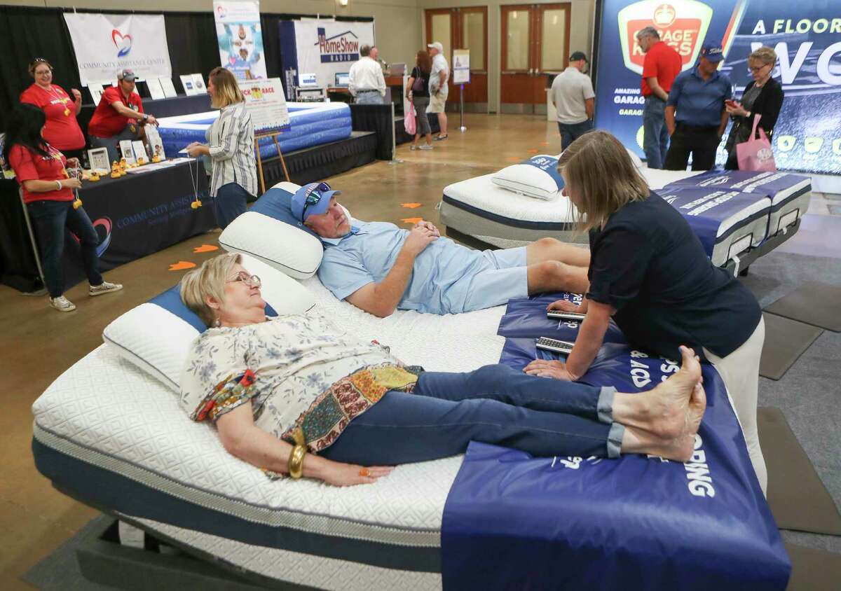 Jolene and Jerry Bevers put in the hard work of testing out beds during the annual Montgomery County Home and Outdoor Living Show at the Lone Star Convention & Expo Center, Saturday, Aug. 20, 2022, in Conroe.
