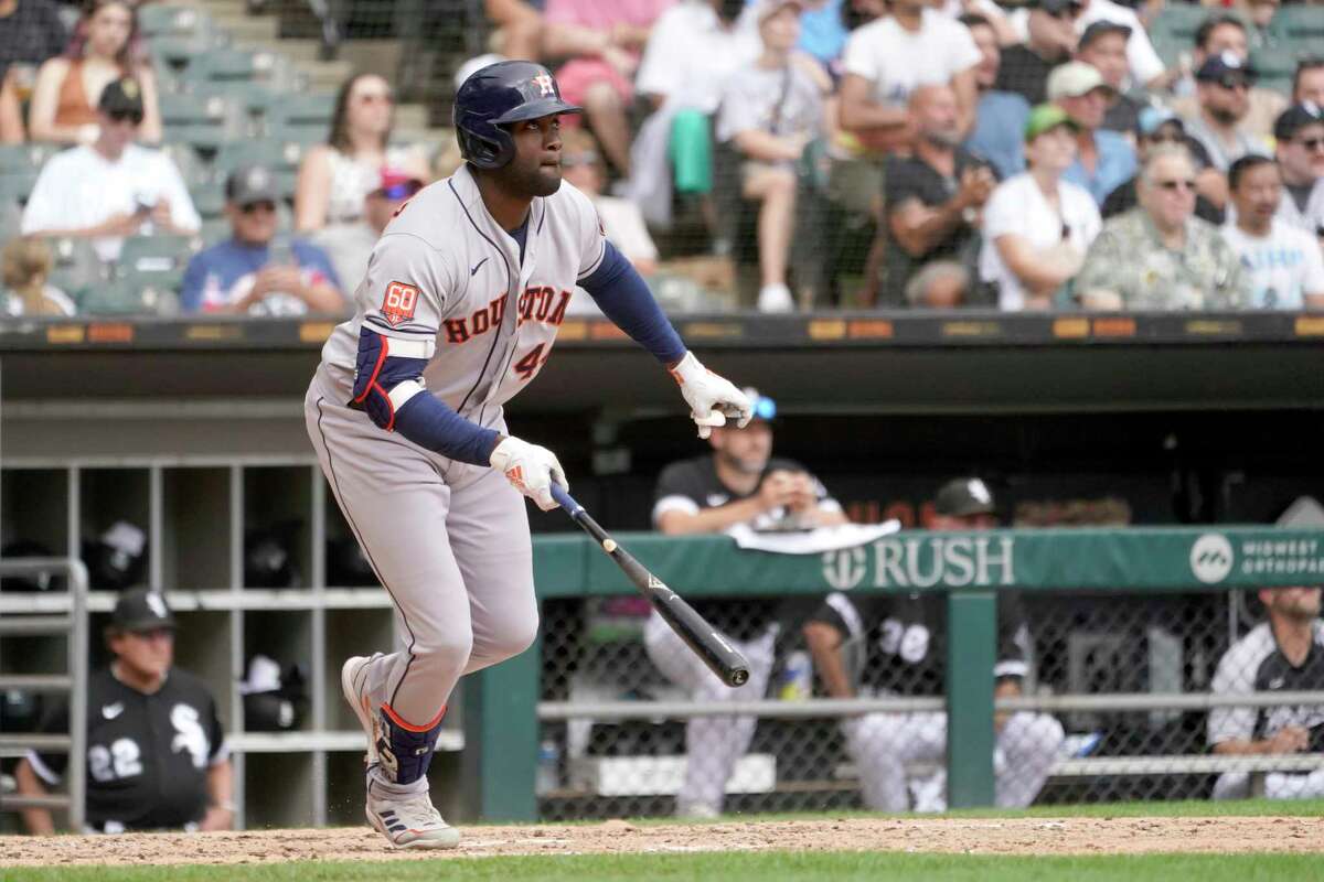 Houston Astros' Yordan Alvarez watches his RBI double off Chicago White Sox relief pitcher Vince Velasquez, scoring Jose Altuve, during the fourth inning of a baseball game Thursday, Aug. 18, 2022, in Chicago.