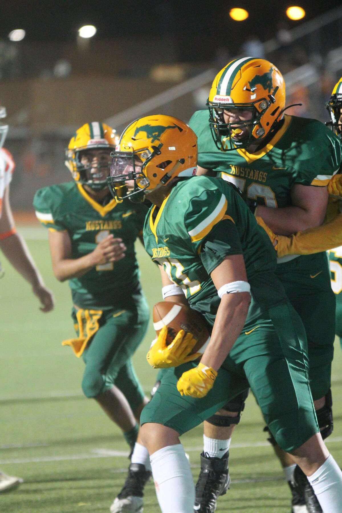 Senior Carlos Jimenez, center, is expected to play defensive end and receiver this year for the Nixon Mustangs.