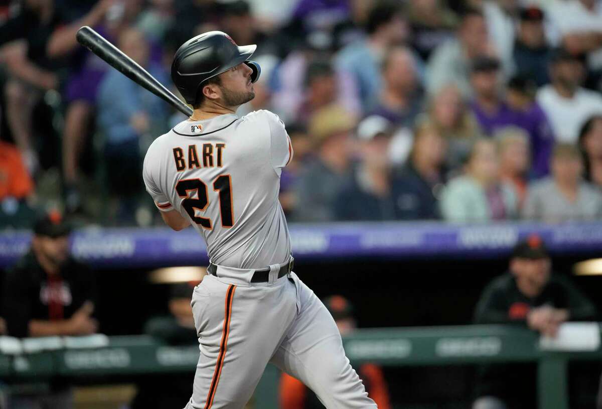 San Francisco Giants' Joey Bart follows the flight of his solo home run off Colorado Rockies starting pitcher Ryan Feltner in the sixth inning of a baseball game against the Saturday, Aug. 20, 2022, in Denver. (AP Photo/David Zalubowski)