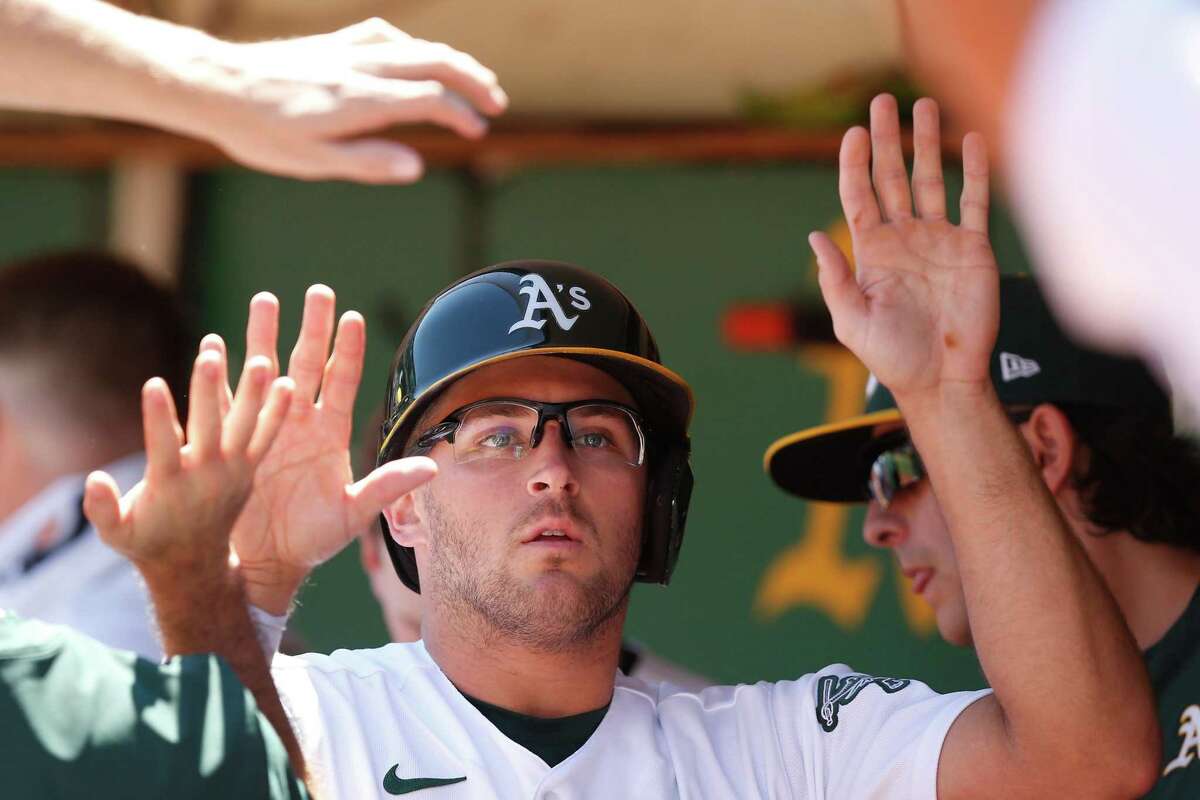 Oakland Athletics starting pitcher JP Sears drops a rosin bag