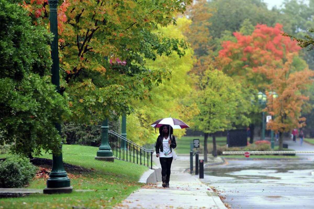 A pedestrian shields herself from the rain as she walks across campus on Wednesday, Oct. 6, 2010, at Union College in Schenectady, N.Y. (Cindy Schultz / Times Union)