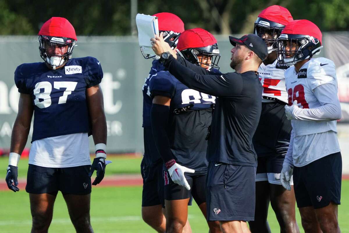 Houston Texans players huddle up to run a special teams play during an NFL training camp Monday, Aug. 22, 2022, in Houston.