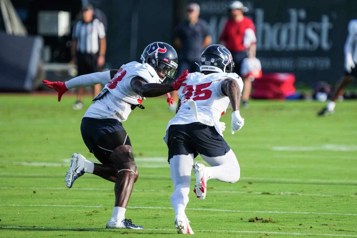 Houston Texans defensive backs Jacobi Francis (38) and Grayland Arnold (35) run a special teams drill during an NFL training camp Monday, Aug. 22, 2022, in Houston.