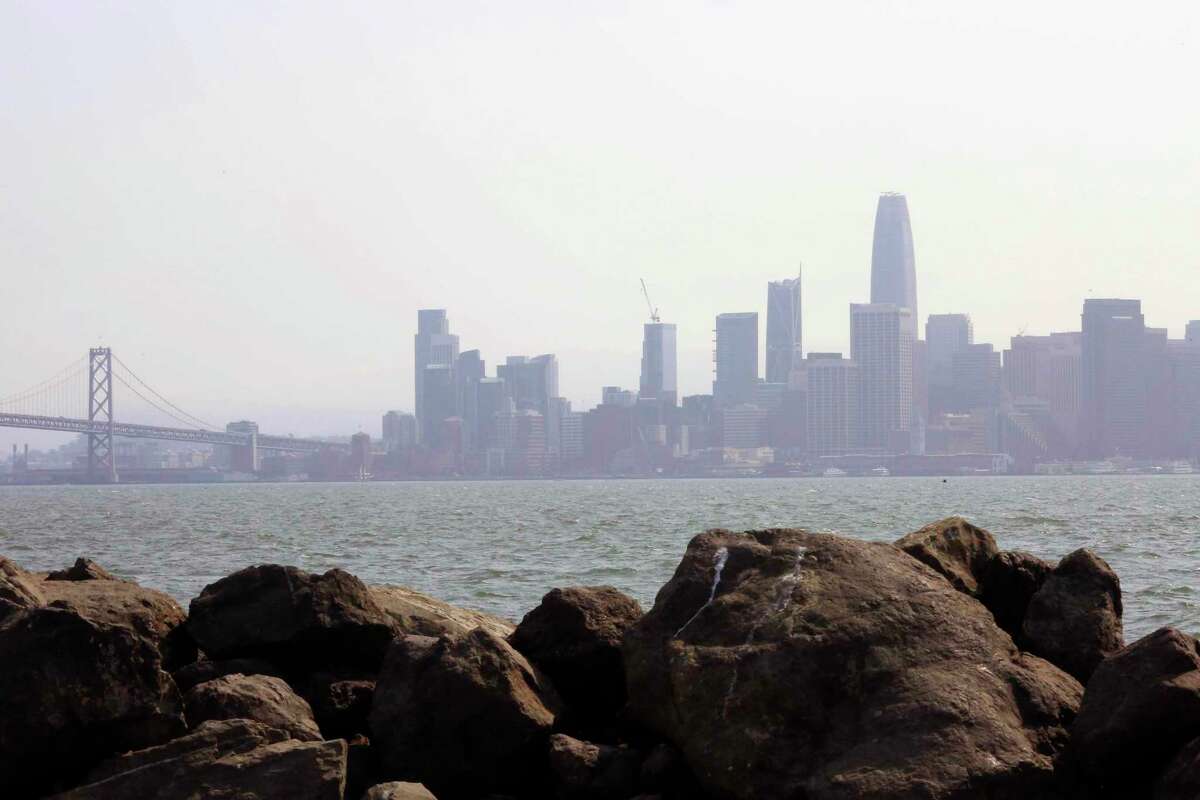 The San Francisco skyline is seen from Treasure Island through haze on Aug. 24, 2018. Wildfire smoke was expected to create hazy conditions across the Bay Area, but not enough to create unhealthy air conditions, officials said.